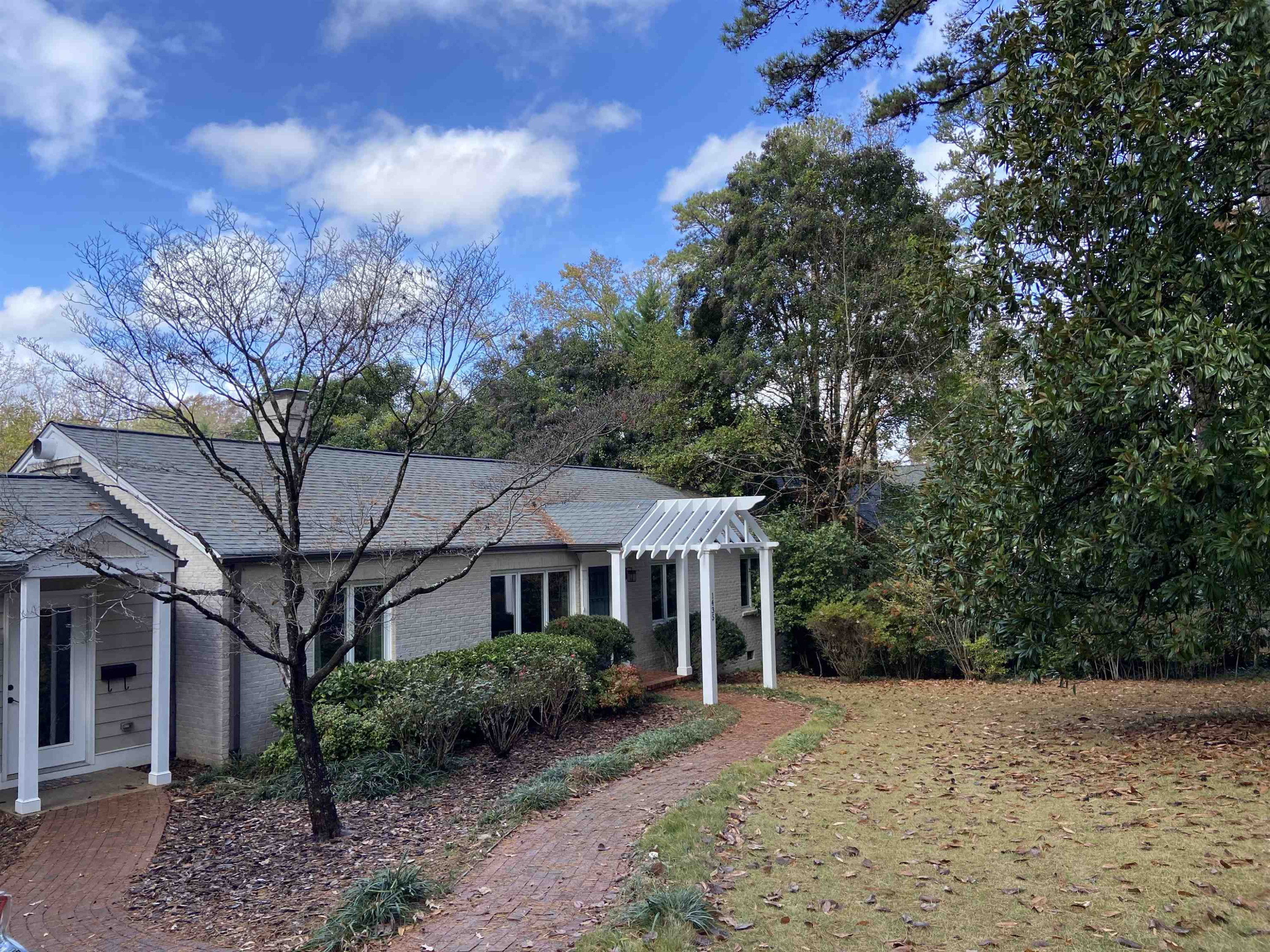 1435 Duplin Road Raleigh, NC 27607 - Photo 3 of 4 a front view of a house with a yard and tree
