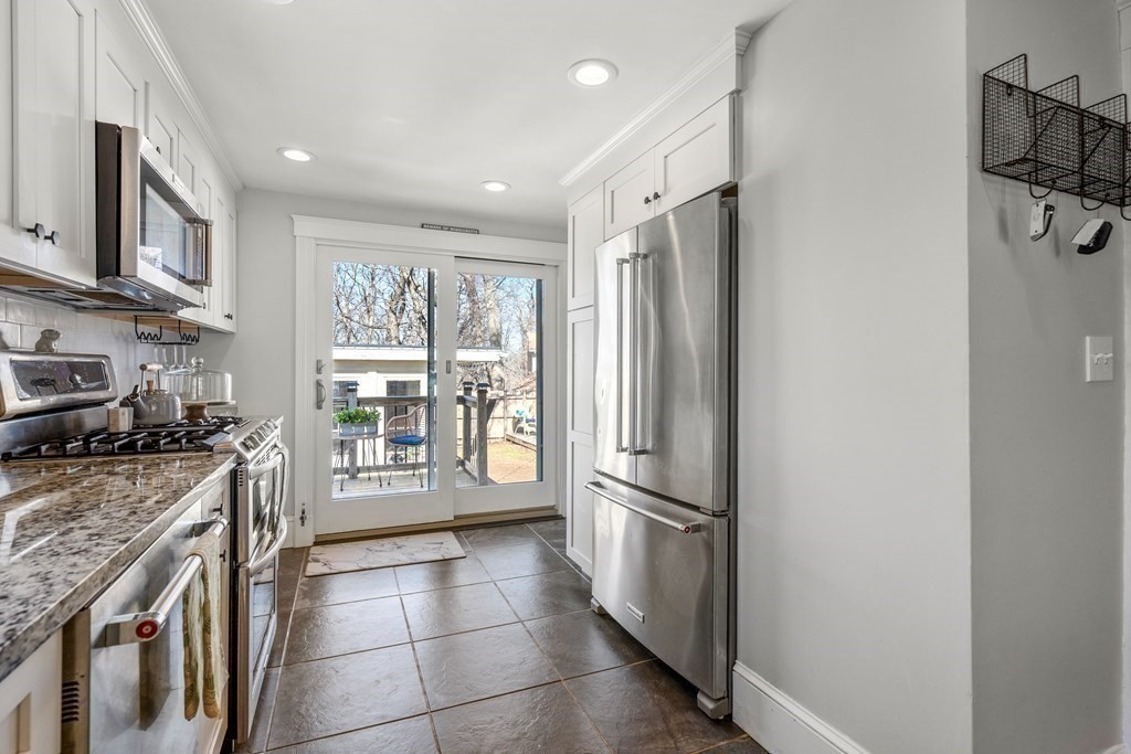 222 Windsor Avenue Swampscott, MA 01907 - Photo 13 of 36 a kitchen with stainless steel appliances granite countertop a refrigerator and a stove top oven