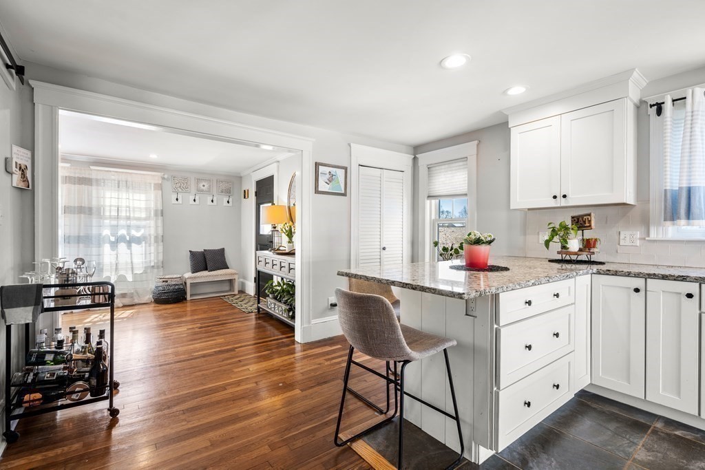 222 Windsor Avenue Swampscott, MA 01907 - Photo 14 of 36 a kitchen with stainless steel appliances a dining table chairs and wooden floor