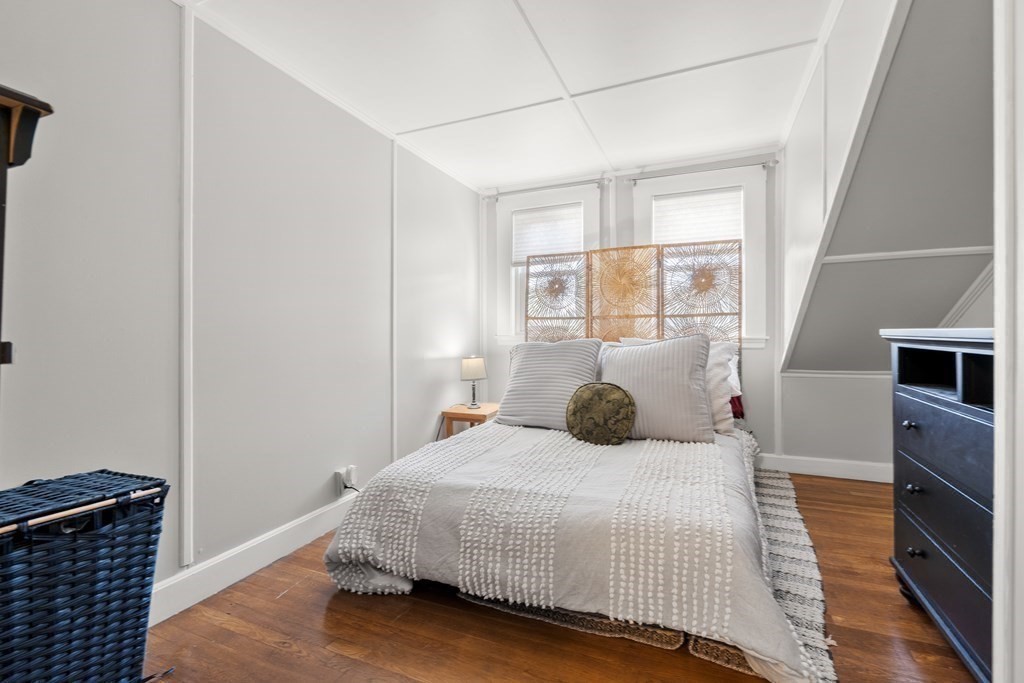 222 Windsor Avenue Swampscott, MA 01907 - Photo 24 of 36 a bedroom with a bed and wooden floor