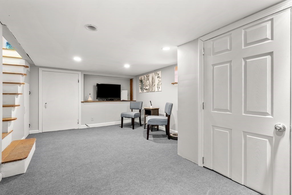 222 Windsor Avenue Swampscott, MA 01907 - Photo 28 of 36 a living room with furniture and a flat screen tv
