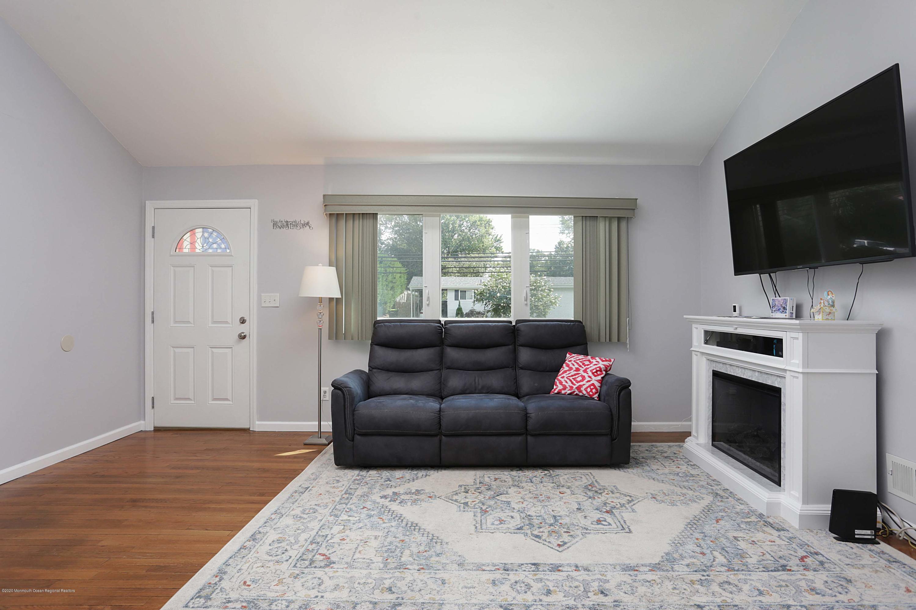 271 Middle Road Hazlet, NJ 07730 - Photo 2 of 11 a living room with furniture and a flat screen tv
