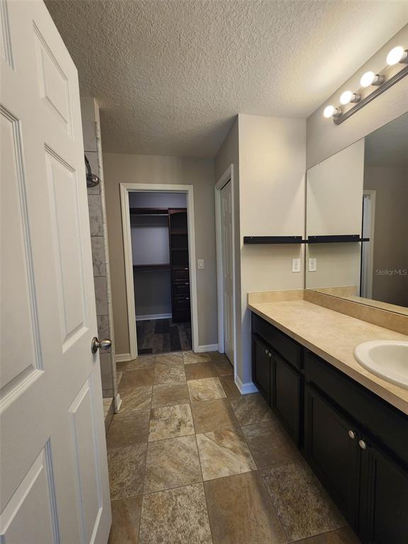 7010 Spotted Deer Place Riverview, FL 33578 - Photo 13 of 21 a kitchen with stainless steel appliances granite countertop a sink and a stove
