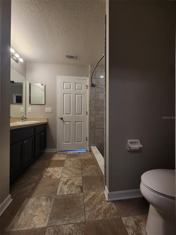 7010 Spotted Deer Place Riverview, FL 33578 - Photo 14 of 21 a bathroom with a sink a toilet and shower