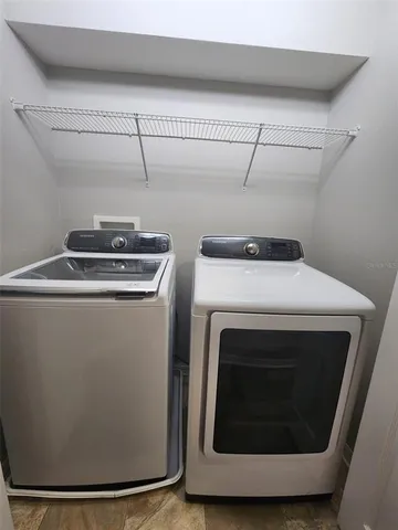 a utility room with dryer and washer