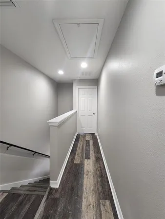 a view of a hallway with staircase