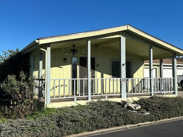 a front view of a house with a small yard