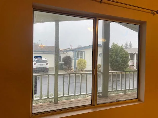 a view of a glass door and a window