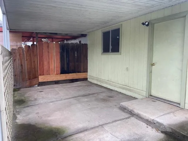 a view of backyard with tub