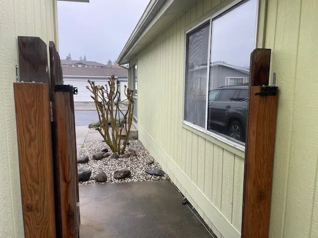 a view of a porch with a refrigerator