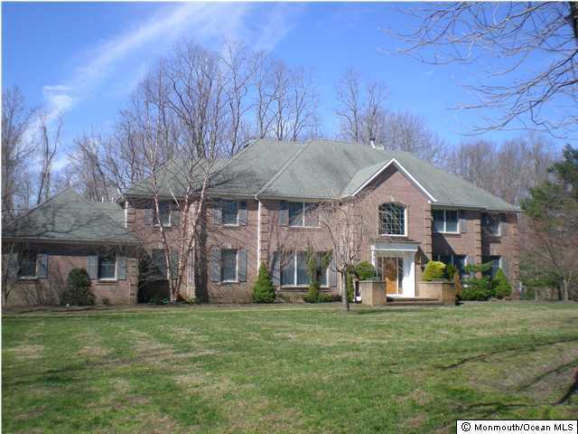 941 Lovett Road Colts Neck, NJ 07722 - Photo 1 of 3 a view of a house with a yard