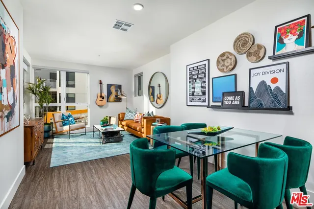 a living room with furniture and a clock