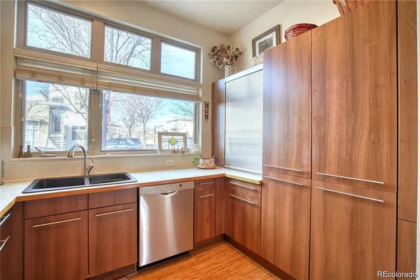 a kitchen with a sink and windows