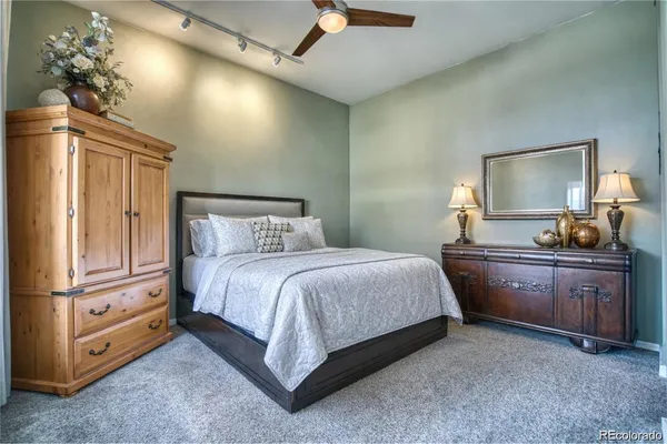 a bedroom with a bed and a dresser