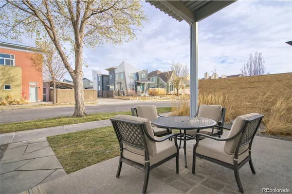 a view of a patio with a table chairs and a table