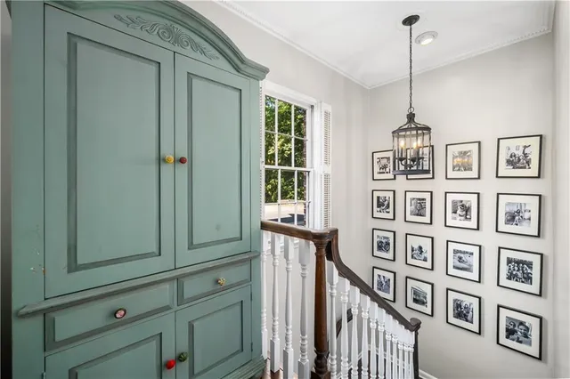 a view of a livingroom with furniture and staircase
