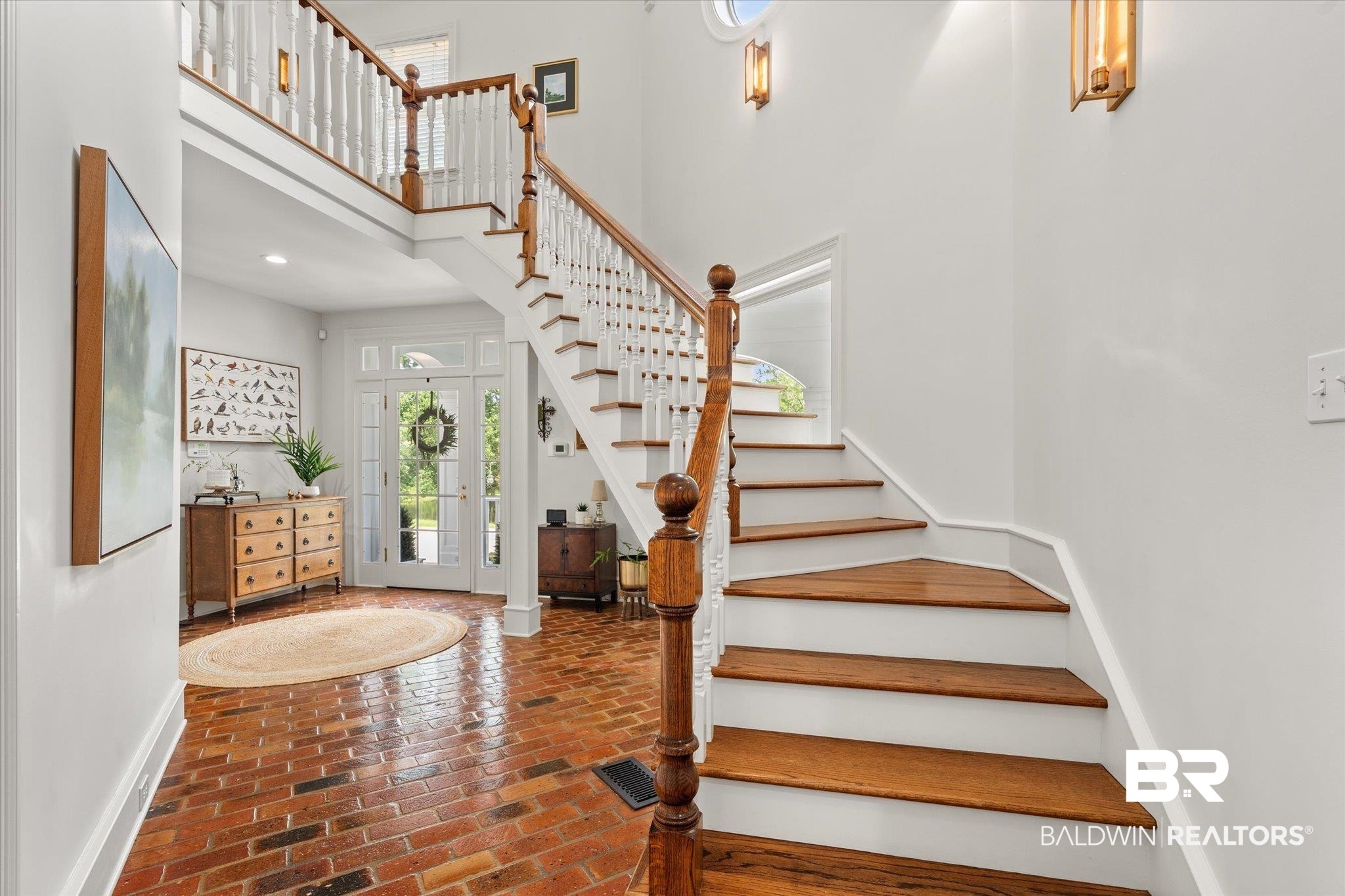 8561 Dawes Lake Road Mobile, AL 36619 - Photo 33 of 63 Entryway with a high ceiling, brick floors, stairway, and recessed lighting