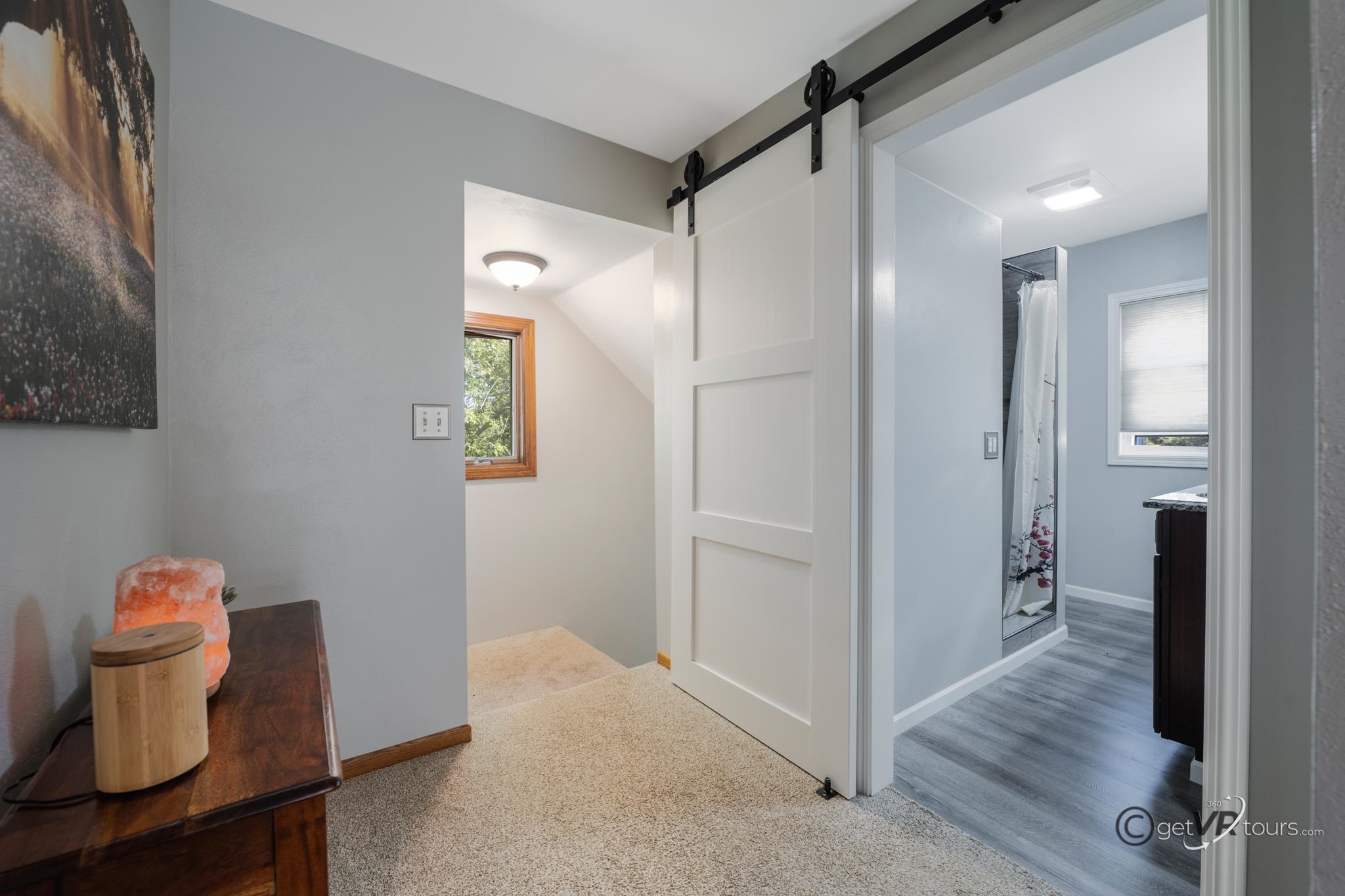 2472 West Red Oak Road Freeport, IL 61032 - Photo 14 of 45 a view of a hallway with wooden floor and a bathroom