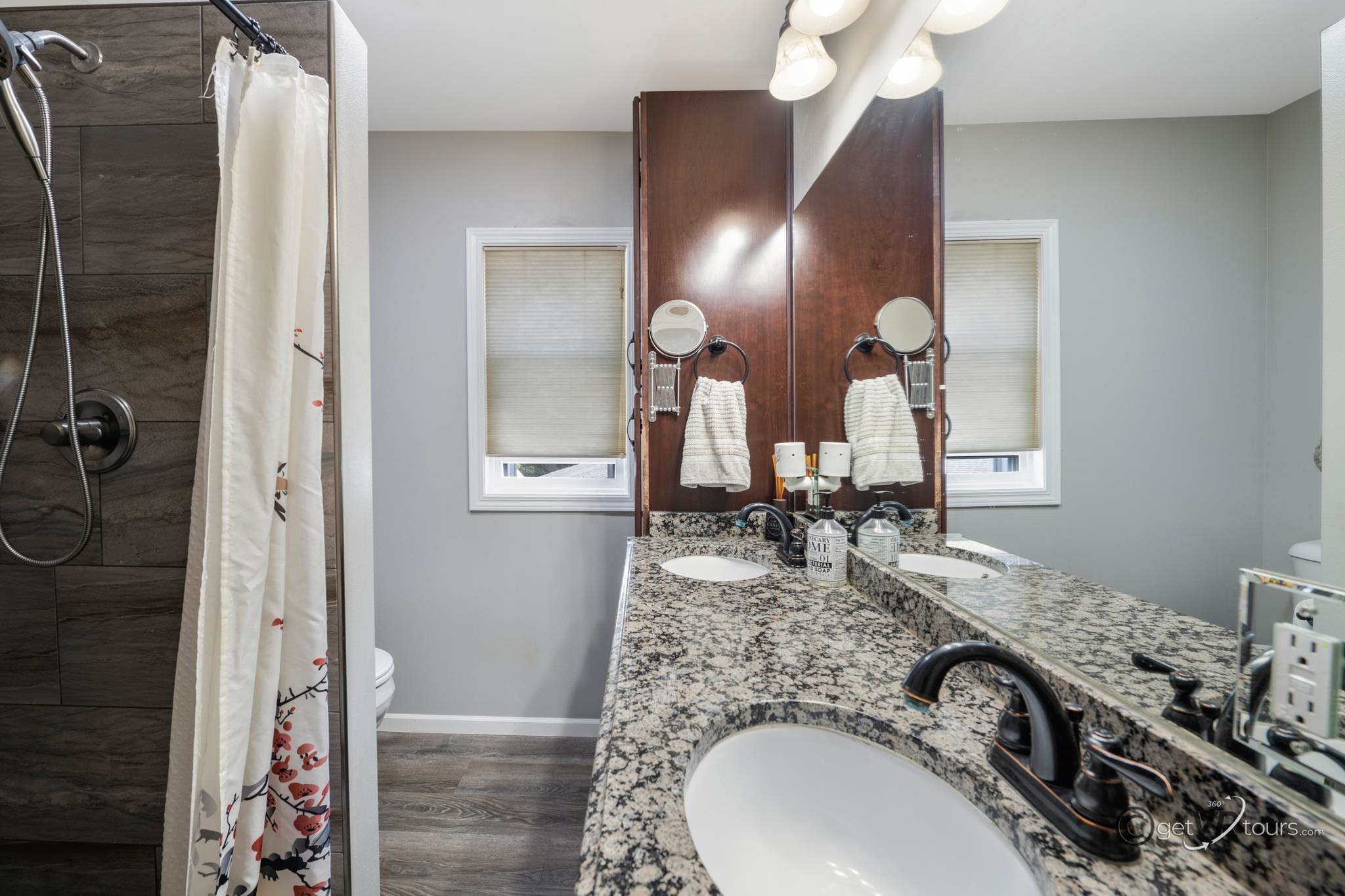 2472 West Red Oak Road Freeport, IL 61032 - Photo 15 of 45 a bathroom with a sink double vanity and a mirror