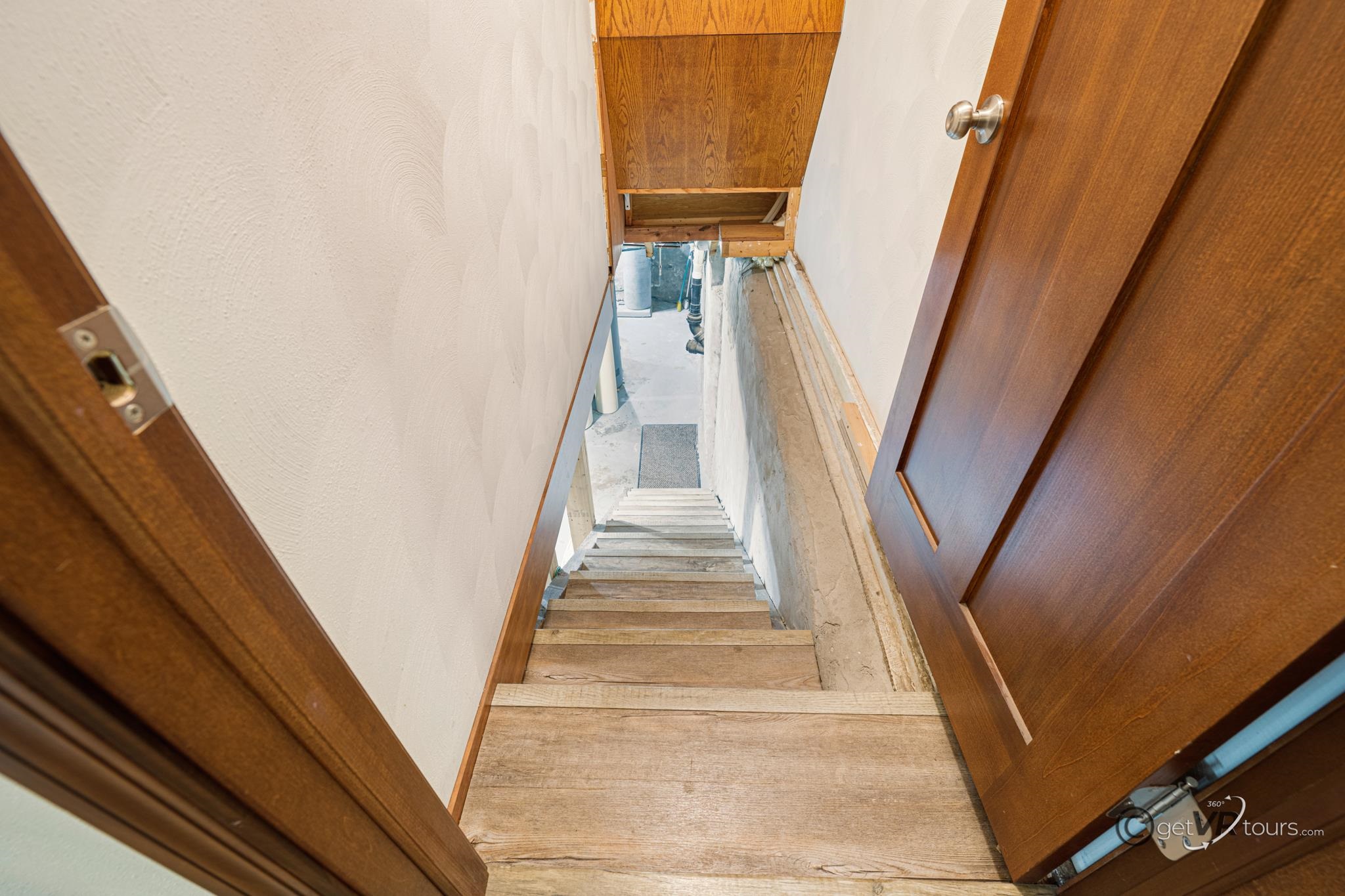 2472 West Red Oak Road Freeport, IL 61032 - Photo 20 of 45 a view of staircase with white walls and black wooden floor