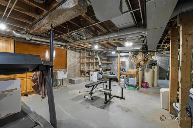a view of a house with a garage and large window