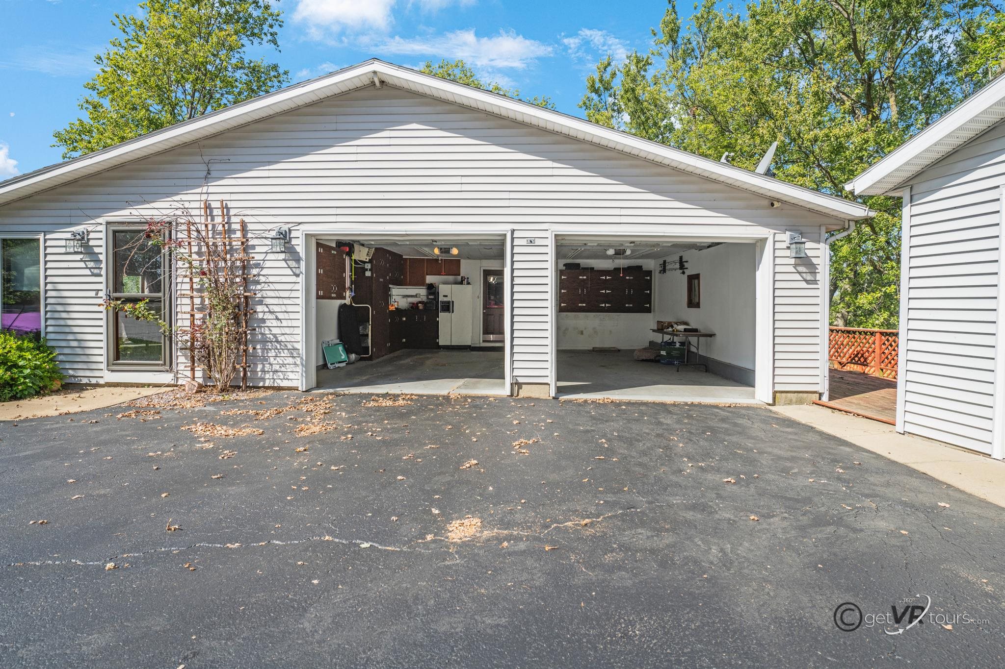 2472 West Red Oak Road Freeport, IL 61032 - Photo 24 of 45 a view of a house with a garage and large window