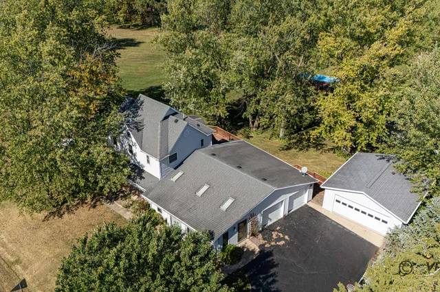 a balcony with wooden floor and outdoor seating