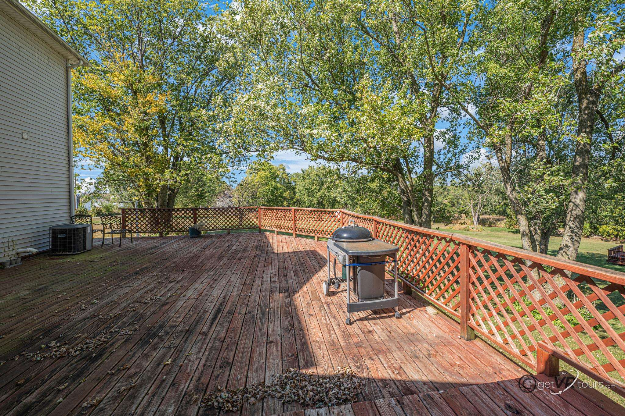 2472 West Red Oak Road Freeport, IL 61032 - Photo 29 of 45 a balcony with wooden floor and outdoor seating