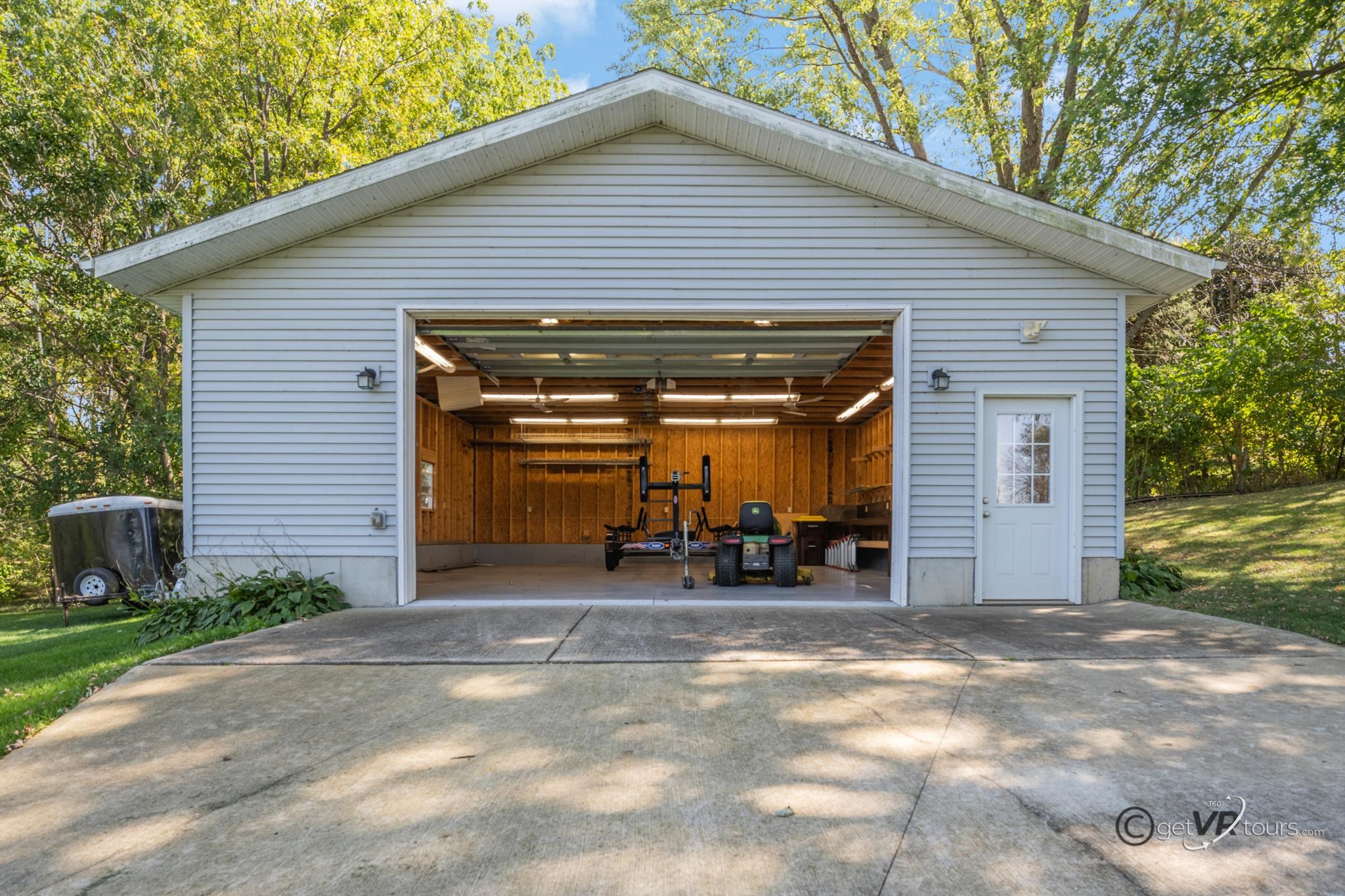 2472 West Red Oak Road Freeport, IL 61032 - Photo 32 of 45 a view of a house with large space and a car parked in front of it