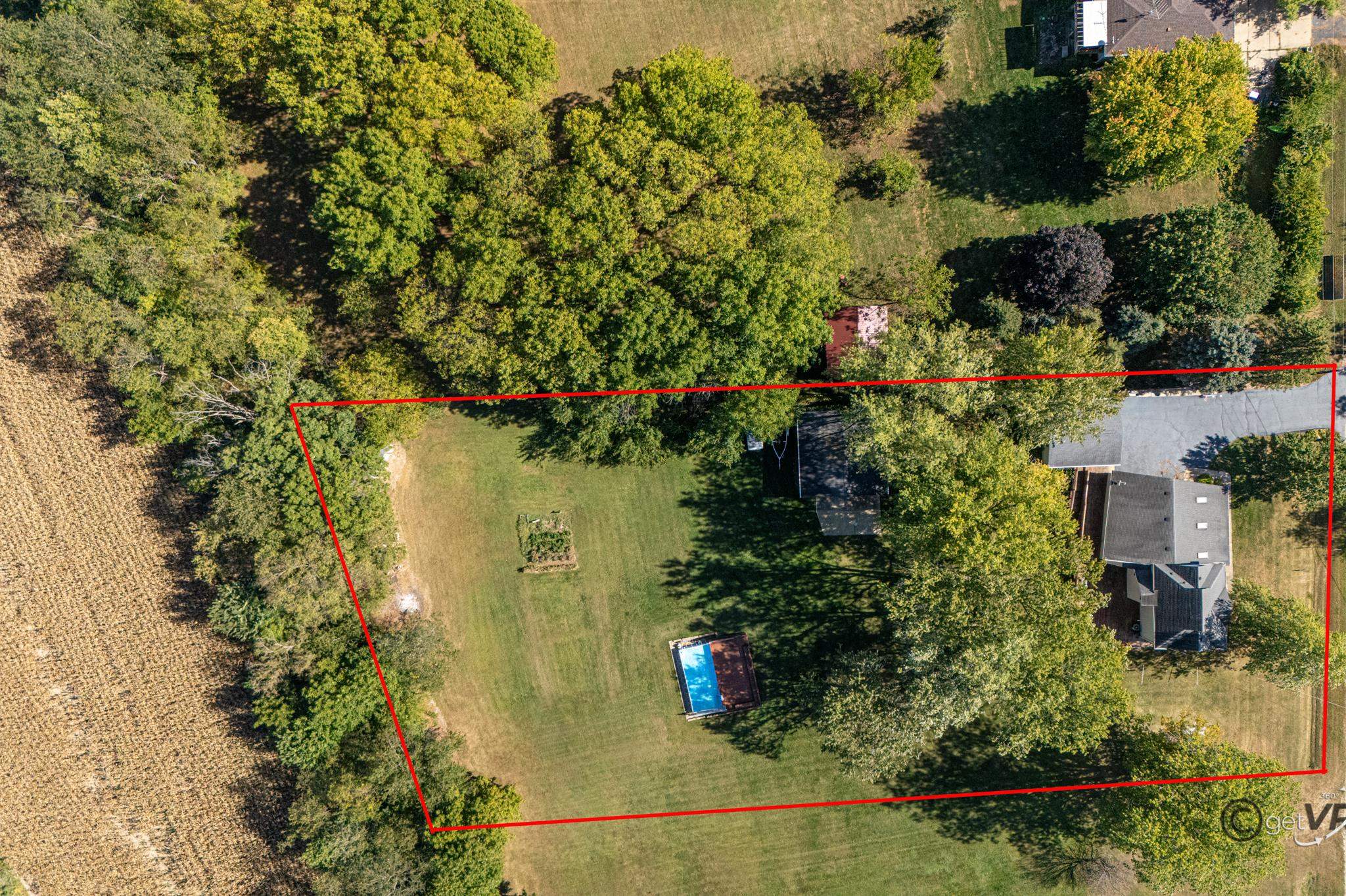 2472 West Red Oak Road Freeport, IL 61032 - Photo 42 of 45 an aerial view of residential house with outdoor space and trees all around