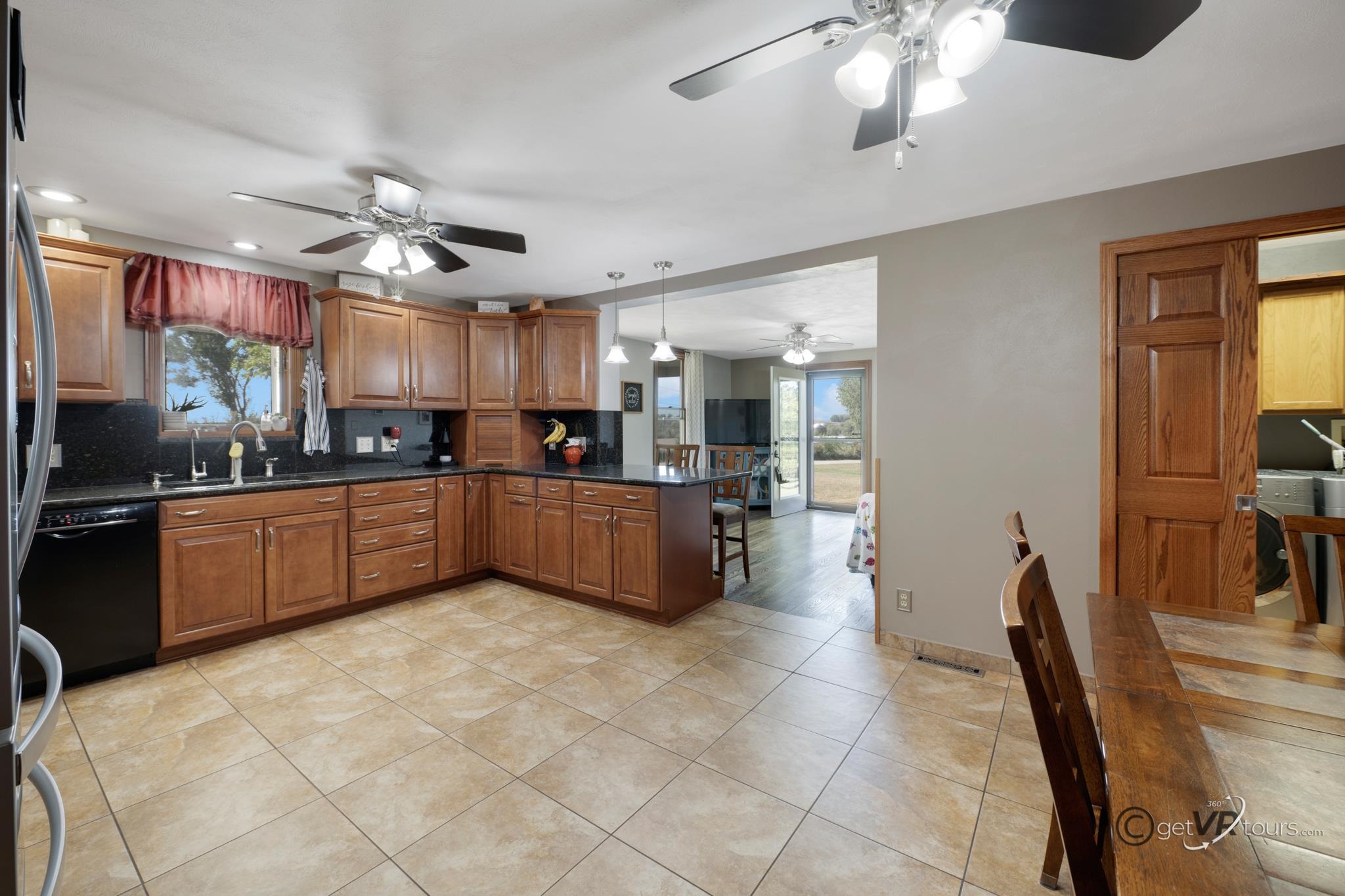 2472 West Red Oak Road Freeport, IL 61032 - Photo 6 of 45 a large kitchen with cabinets and chairs