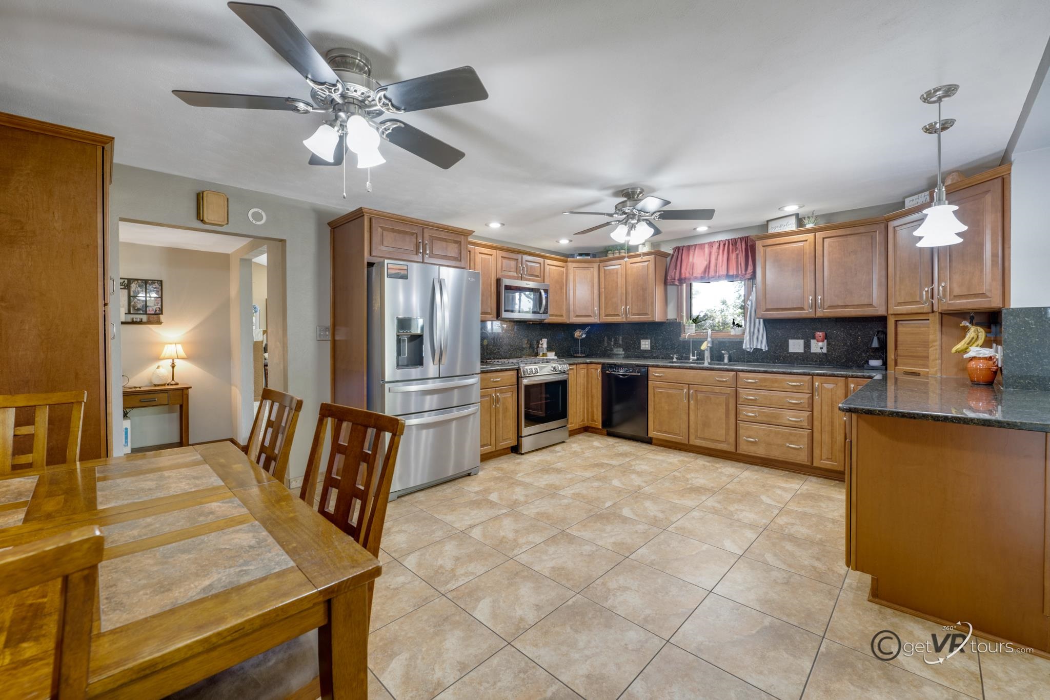 2472 West Red Oak Road Freeport, IL 61032 - Photo 7 of 45 a large kitchen with cabinets and stainless steel appliances