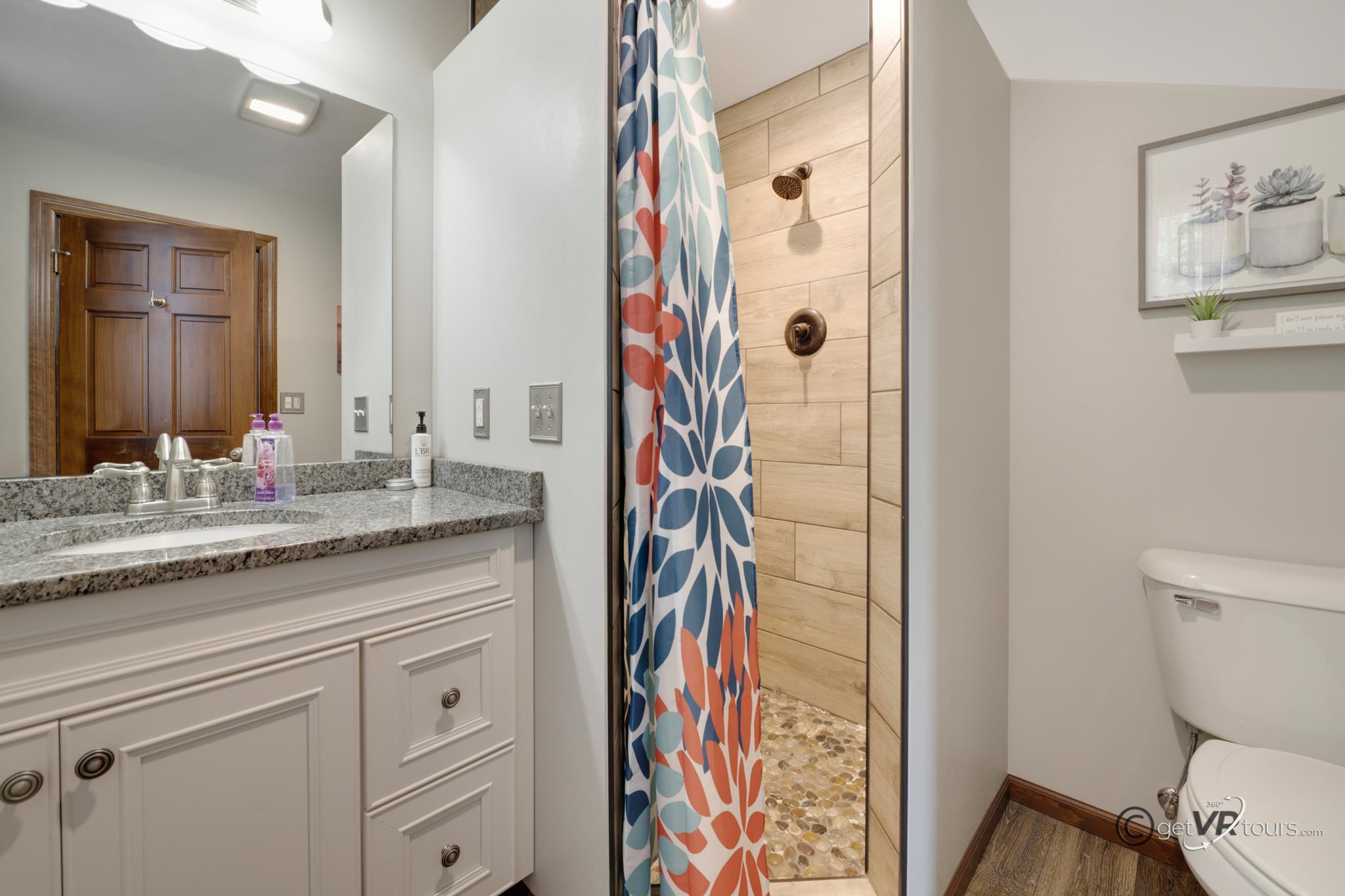 2472 West Red Oak Road Freeport, IL 61032 - Photo 10 of 45 a bathroom with a granite countertop sink a toilet and shower