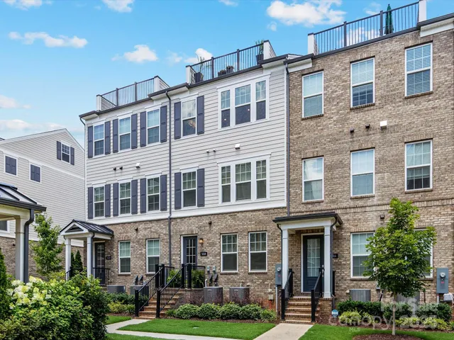 a front view of a building with garden