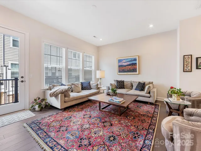 a living room with furniture or couch and a large window