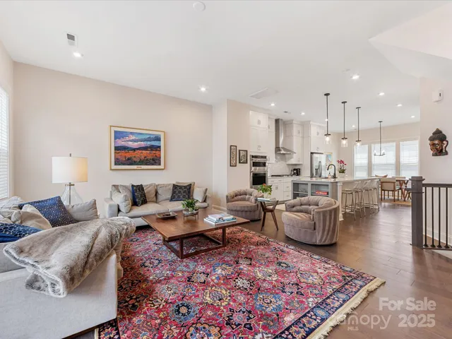 a living room with lots of furniture and a rug