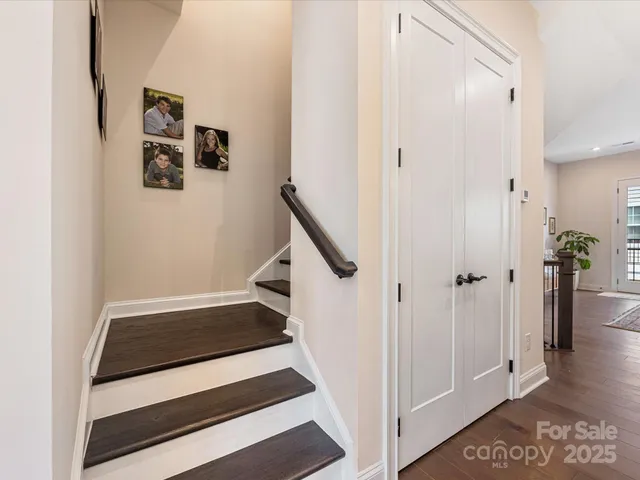 a view of entryway with stairs and wooden floor