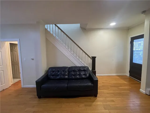 a kitchen with a sink a counter cabinets and appliances