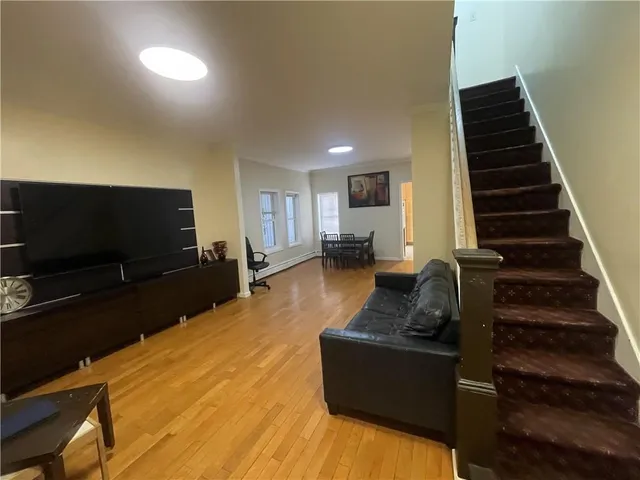 a view of a dining room with furniture and a window