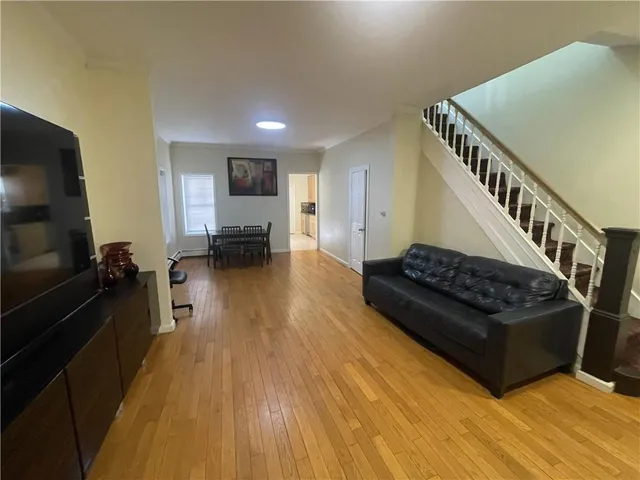 a view of hallway with furniture and a window