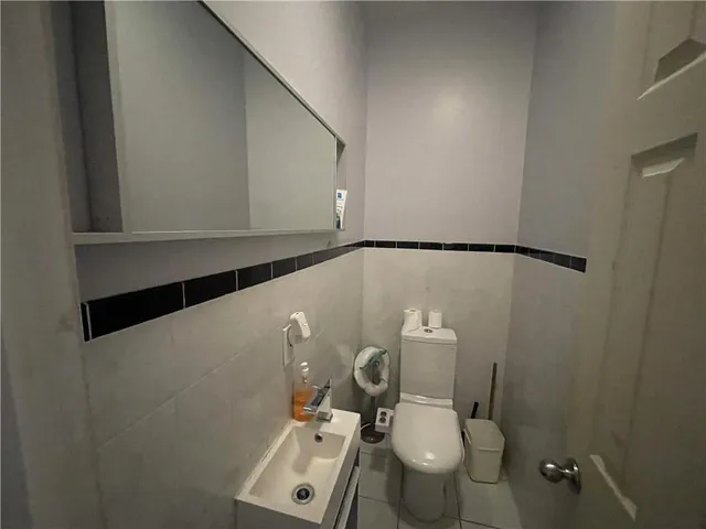 a kitchen with stainless steel appliances granite countertop a stove a microwave and a sink