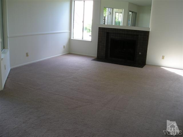 1712 Sinaloa Road, Unit 102 Simi Valley, CA 93065 - Photo 3 of 6 a view of empty room with a fireplace