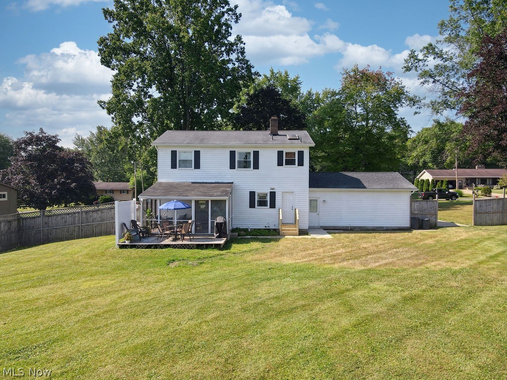 3137 Queen Road Ravenna, OH 44266 - Photo 31 of 33 Rear view of property featuring a wooden deck and a lawn
