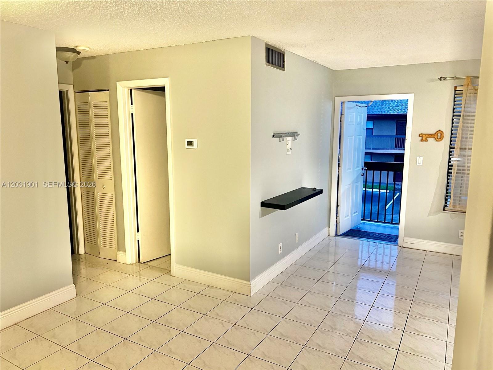 10002 Winding Lake Road, Unit 203 Sunrise, FL 33351 - Photo 4 of 15 Living room/Dining room