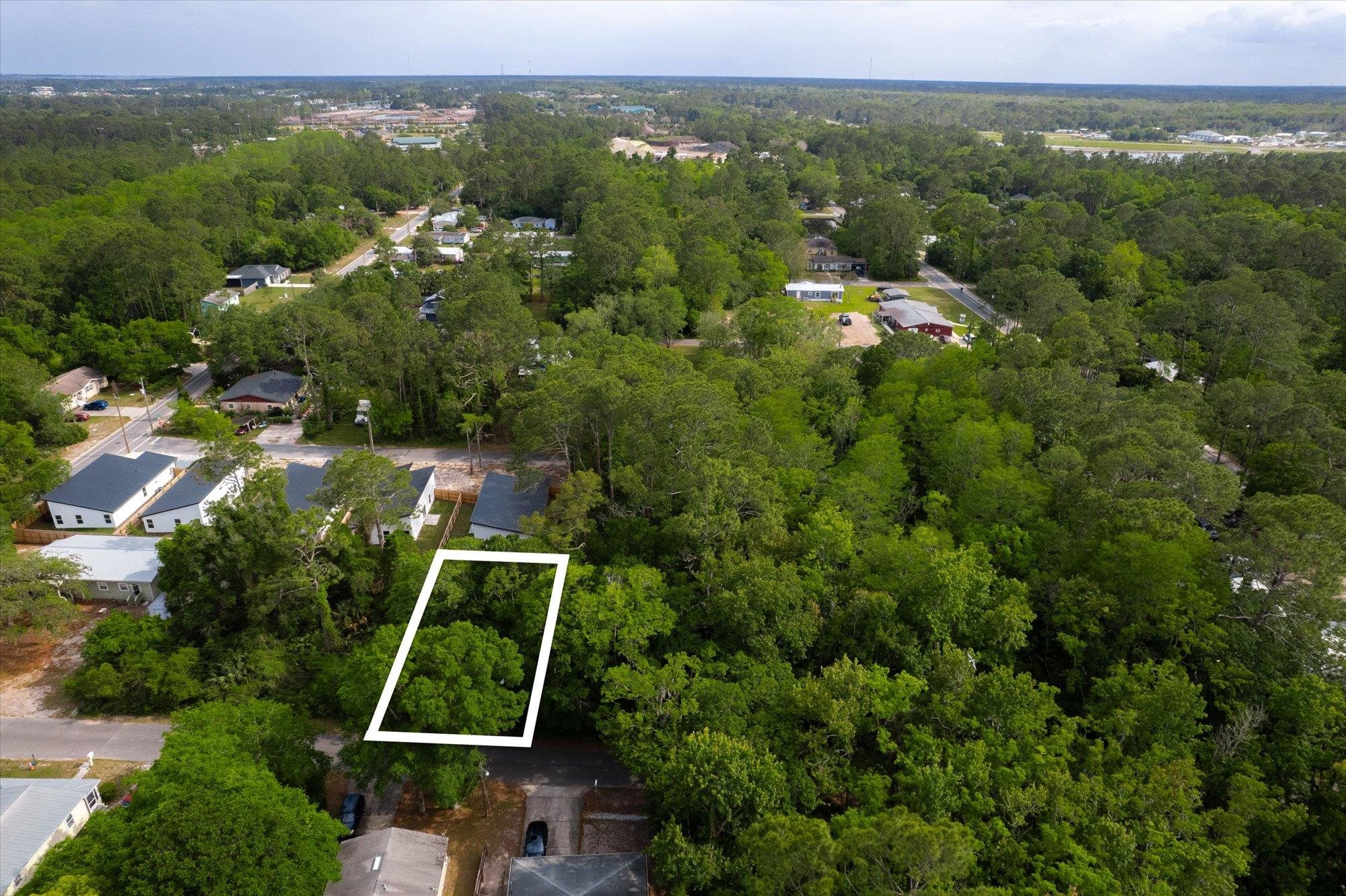 0 West 8th Street St. Augustine, FL 32084 - Photo 8 of 31 an aerial view of a residential houses with outdoor space and trees