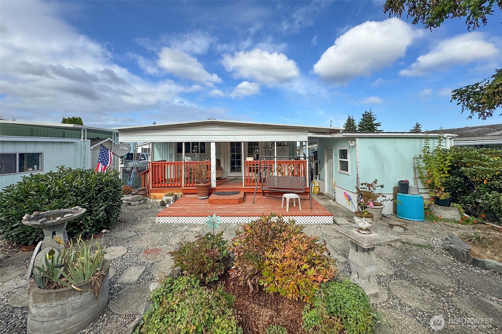 a view of a house with backyard sitting area and garden