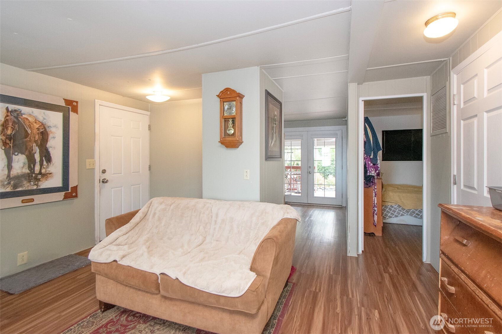 921 South 3rd Avenue, Unit 7 Sequim, WA 98382 - Photo 12 of 32 a living room with wooden floor and furniture