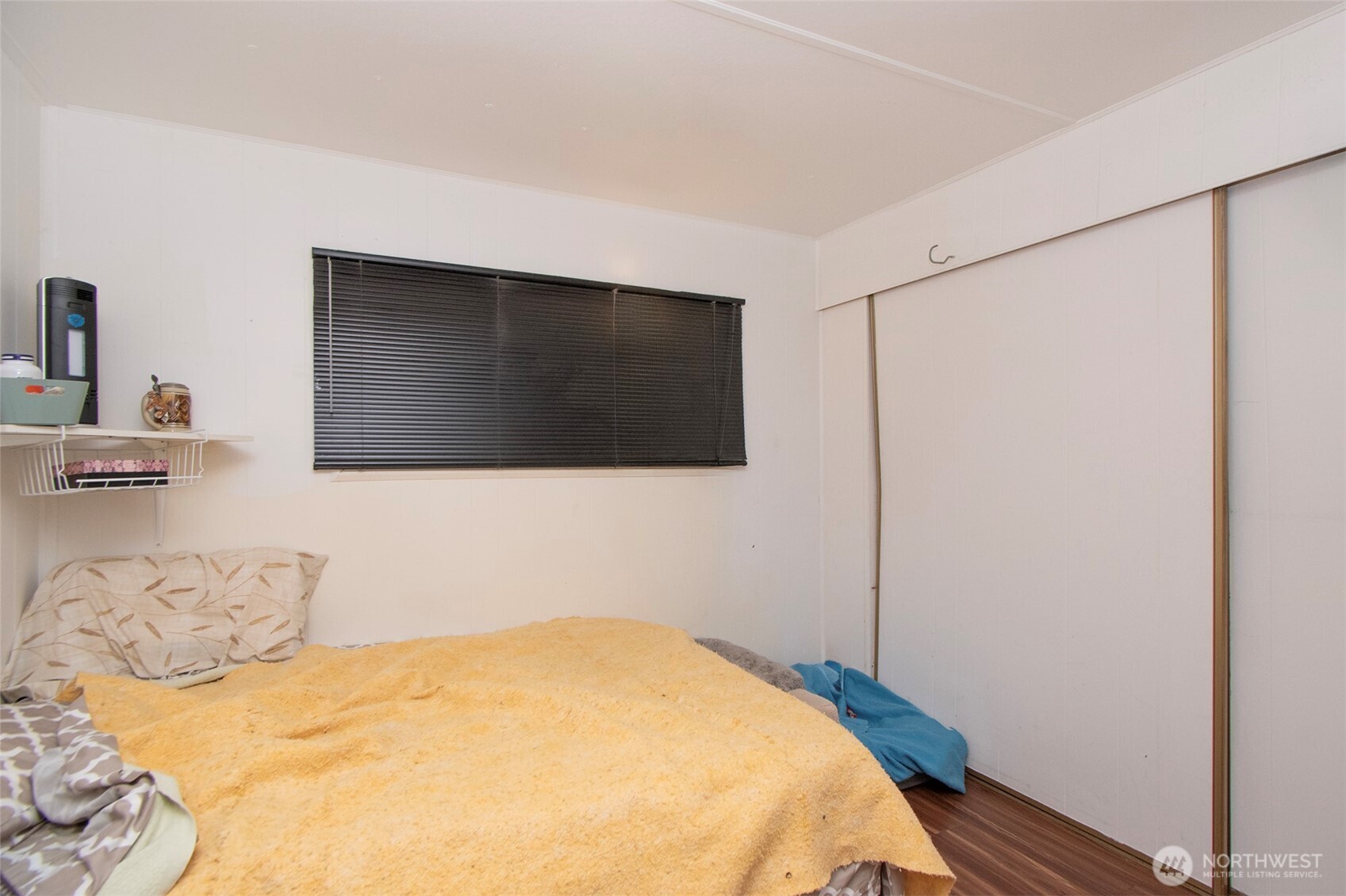 921 South 3rd Avenue, Unit 7 Sequim, WA 98382 - Photo 13 of 32 a bedroom with a bed and a flat screen tv