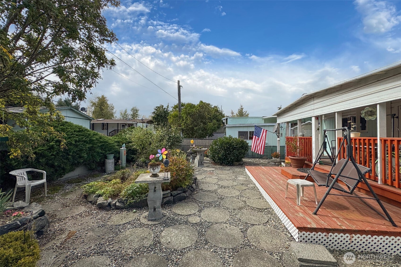 921 South 3rd Avenue, Unit 7 Sequim, WA 98382 - Photo 23 of 32 a view of a chair and tables in the patio