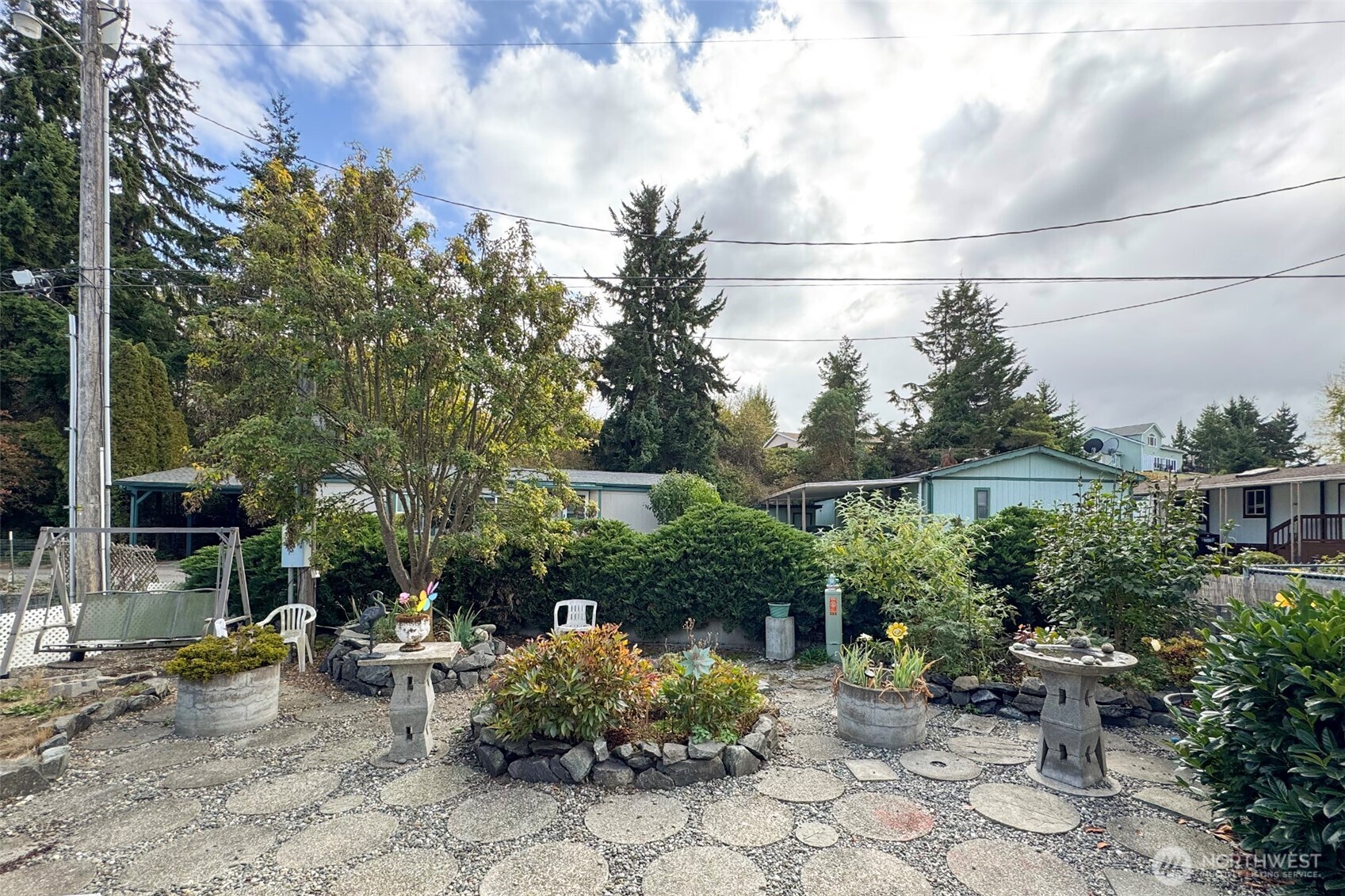 921 South 3rd Avenue, Unit 7 Sequim, WA 98382 - Photo 24 of 32 a view of backyard with outdoor seating and plants
